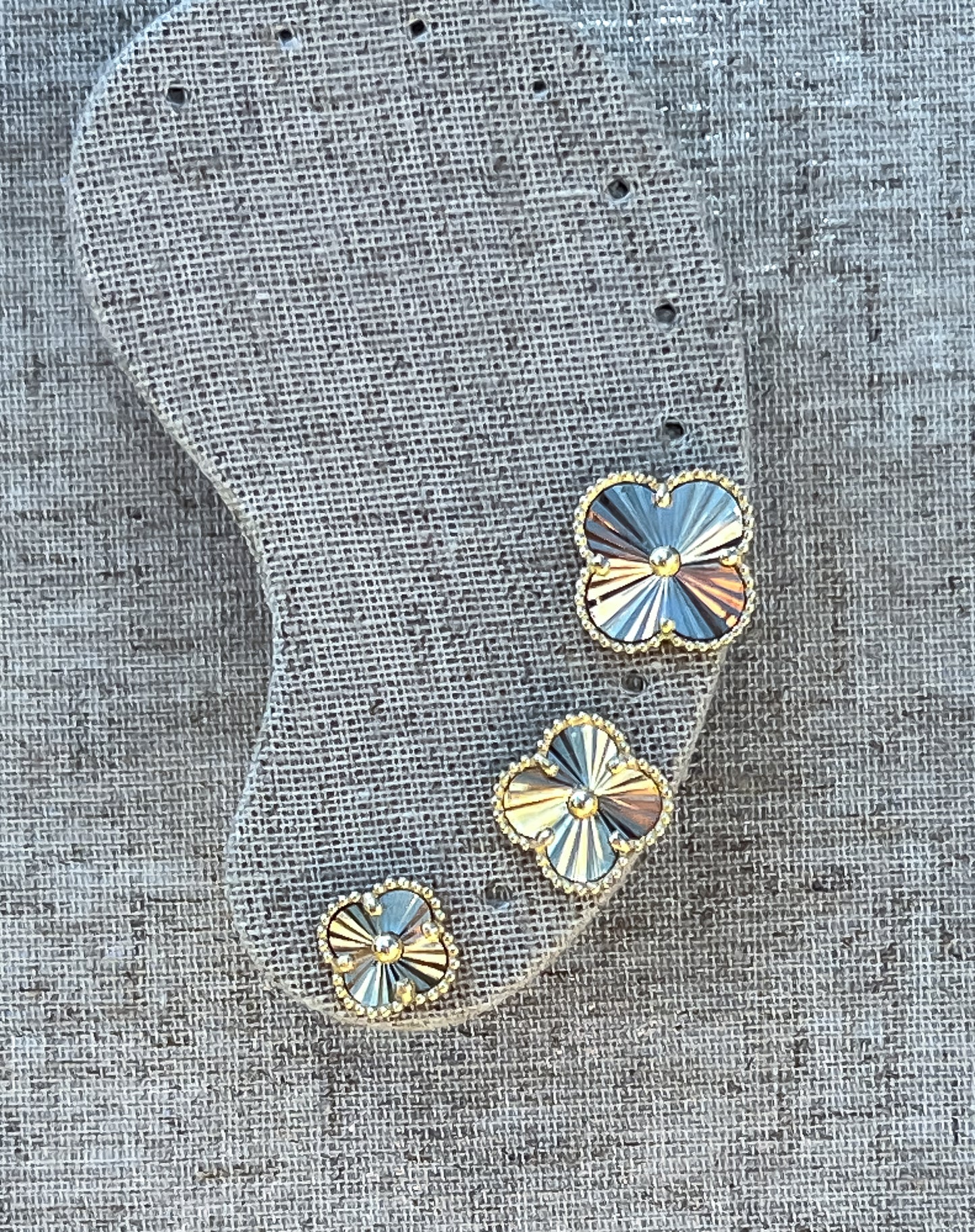 Gold sunburst clover earrings