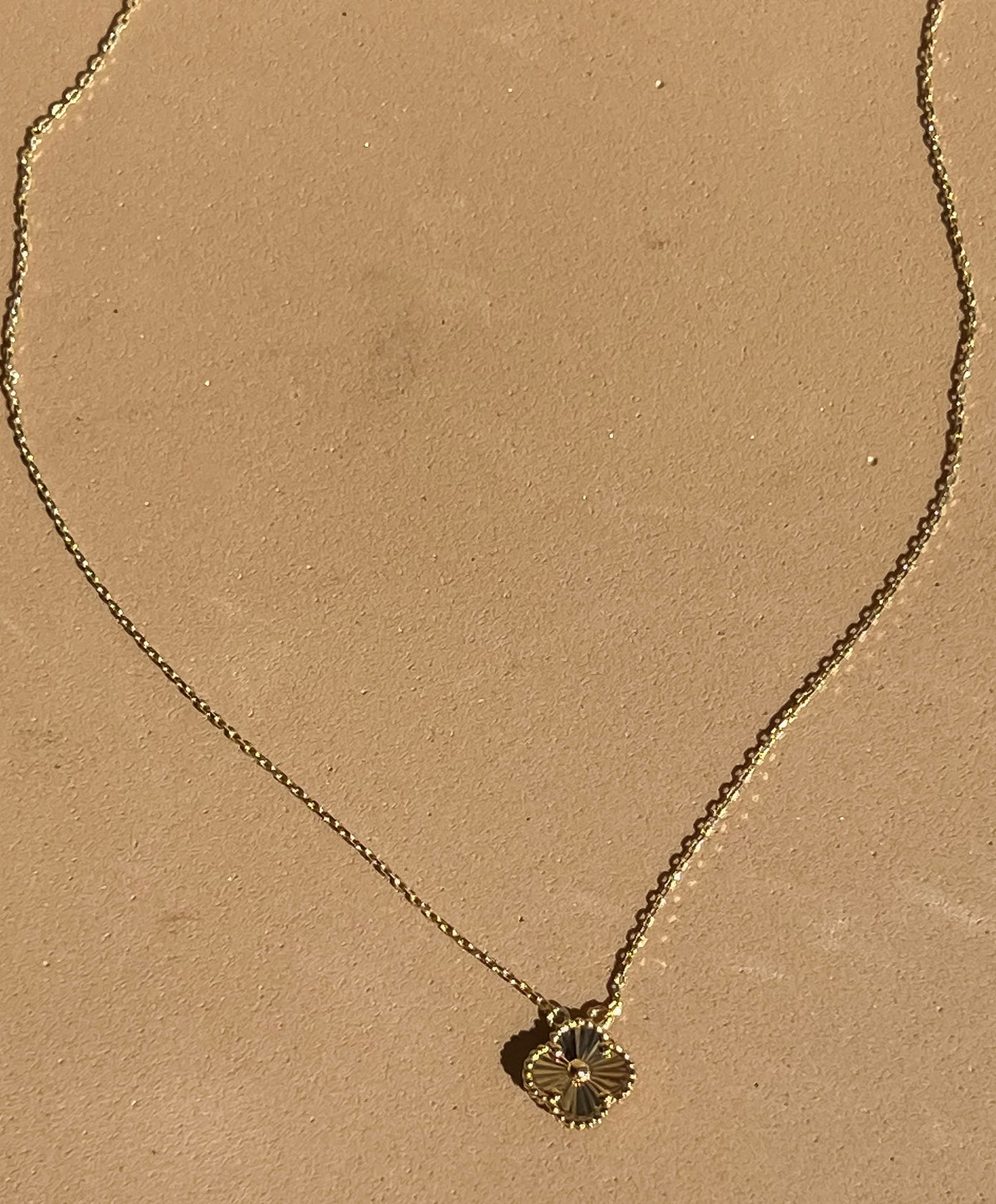 Dainty 10k yellow gold mini sunburst clover necklace