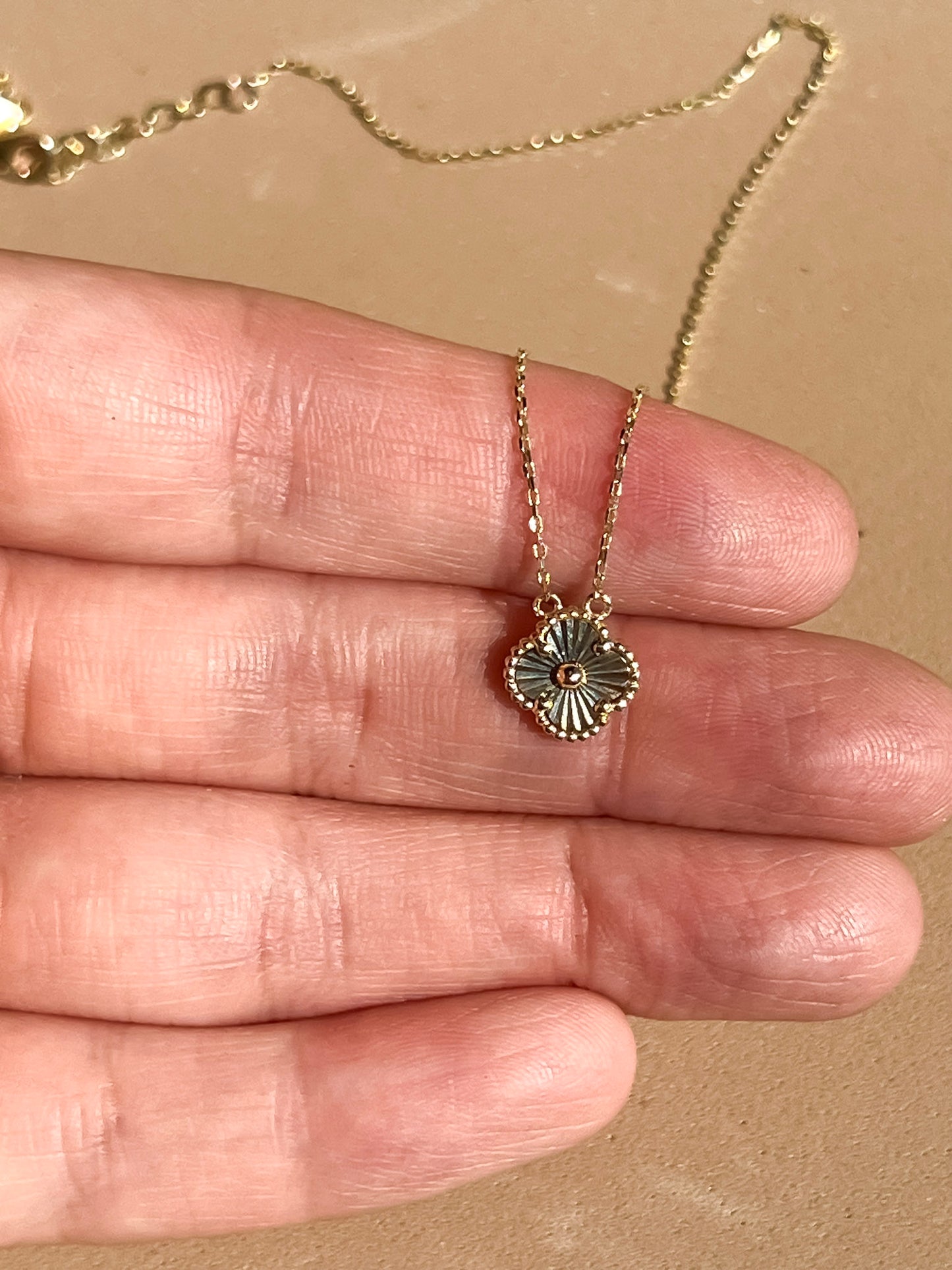 Dainty 10k yellow gold mini sunburst clover necklace