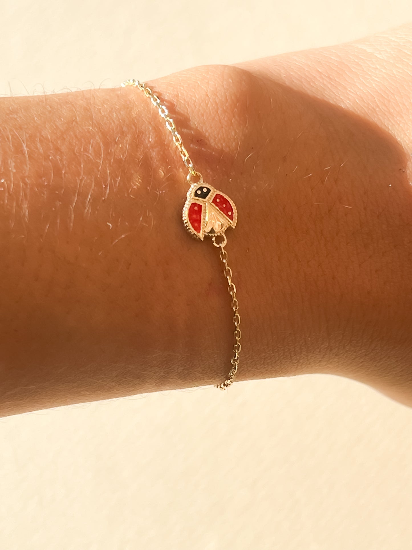 Dainty 10k gold ladybug bracelet